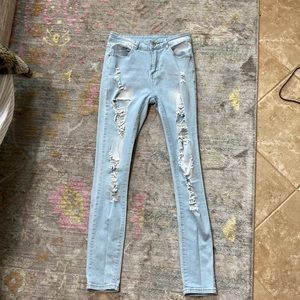 Plain light blue ripped jeans
